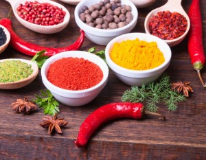 Various kind of spices on wooden background